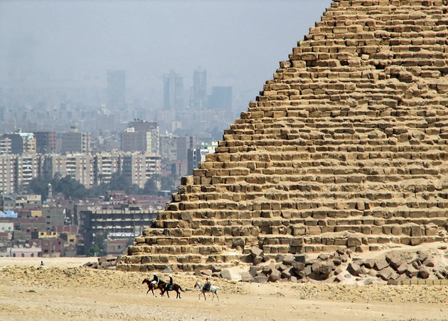 egypt-pyramids-of-giza-great-pyramid-stonework-with-city-behind