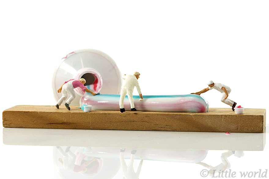 little people painting the colors of toothpaste