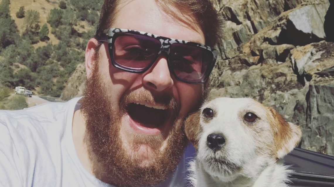bearded man with dog